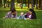 Mother, father and little baby leisures in park