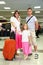 Mother, father and little daughter with baggage