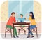 Mother, father and son playing board game together. Family members playing chess sitting at table