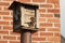 Mother feeding her baby at a bird feeder