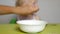 Mother feeds her baby oatmeal, close-up, child nutrition, breakfast, portrait, caucasian