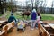 Mother with four kids discovering and watching camels at zoo