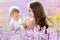 Mother and gaughter playing in lavender field