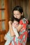 Mother gently hugs the baby. at home. Mom and newborn baby. Mom hugs and holds the newborn baby in her arms, the newborn sleeps in
