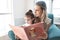 Mother, girl and reading kids book for child education development learning language, communication or literacy at home