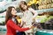 Mother and girl shopping in supermarket