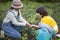 Mother gives his sun a germ in summer garden