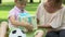 Mother gives surprise box with present to happy son, happy together, adoption