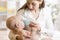 Mother gives to drink water baby from bottle