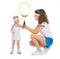 Mother giving baby tennis racket