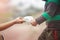 Mother giving her baby daughter protective mask for protect and to stop corona virus outbreak