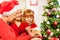 Mother and grandmother giving present to daughter