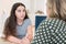 Mother Having Serious Conversation With Teenage Daughter At Home