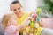 Mother helping baby made Easter decoration