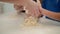 Mother helping son cooking dough. Woman teaching kids cooking cake