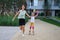 Mother helps daughter learn to roller skate.