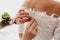 Mother helps fasten a wedding dress the bride before the ceremony. Wedding concept. Artwork