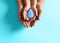 Mother and her child holding water drop on blue background, top view. Ecology protection