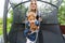 Mother and her children on garden trampoline who cheerfully spend time