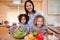 Mother and her daughters preparing salad