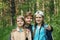 Mother and her daughters teenagers in park