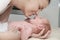 Mother and her Newborn Baby, Parent holding newborns hands