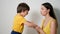 Mother with her son a child of three years in yellow t-shirts