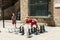 A mother and her son play with a giant chess in the square of the old medieval hospital, in the Raval neighborhood, in Barcelona.