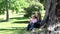 Mother and his daughter holding a pinwheel in a park