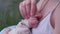 Mother holding hand of sleeping newborn baby closeup.. Healthcare, love, concept