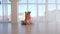 Mother hugging with daughter sitting on the floor in dance studio