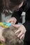 Mother inspect childs head for lice