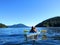 A mother kayaking with her young daughter on the ocean on a beautiful sunny day along the sunshine coast outside of Vancouver