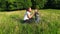 Mother and kid blowing dandelion flower