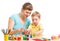 Mother and kid plasticine modeling together isolated