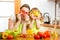 Mother and kid preparing healthy food and having fun