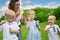 Mother with kids blowing bubbles