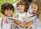 Mother and kids reading a book