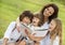 Mother and kids reading a book