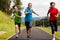 Mother with kids running in park