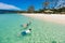 Mother and kids snorkeling