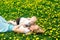 Mother Kissing Baby in Dandelions