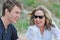 Mother laughing smiling loving sharing time with son on summer beach holiday