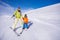 Mother and little boy learning to ski holding hand