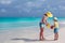 Mother and little daughter on the beach during their carribean vacation