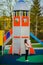 Mother and little daughter are walking and playing on the playground in the park