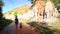 Mother Little Girl Walk along Water Stream to Steep Cliff