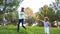 Mother and little son running across the green park