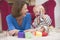 Mother in living room playing with baby