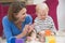 Mother in living room playing with baby